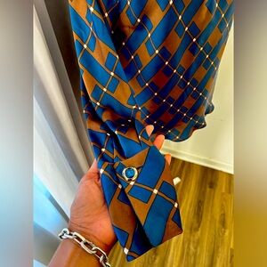 Chocolaté and Royal Blue long sleeve blouse with gem detail on cuff.